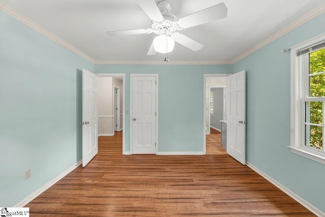 111 Bonwood Ave, Simpsonville, SC 29681 - unfurnished bedroom featuring wood finished floors, ornamental molding, and a ceiling fan