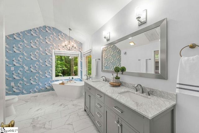 111 Bonwood Ave, Simpsonville, SC 29681 - full bathroom featuring vaulted ceiling, double vanity, a freestanding tub, marble look tiles, and a chandelier