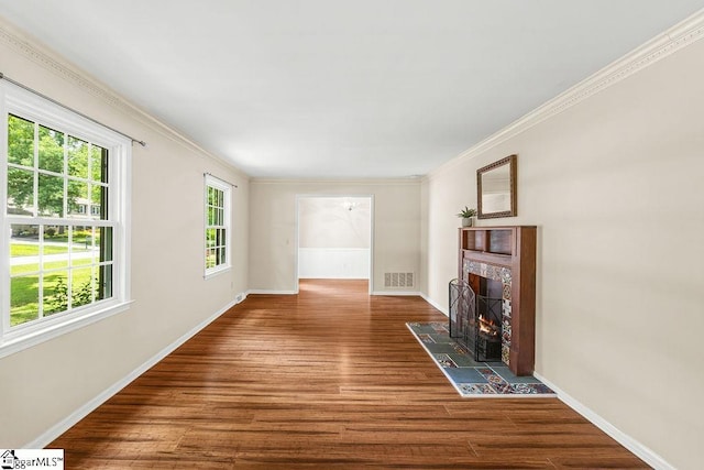 111 Bonwood Ave, Simpsonville, SC 29681 - unfurnished living room with wood finished floors, ornamental molding, and a tile fireplace