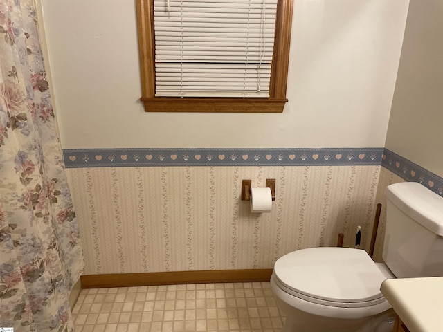 504 N Adair St, Clinton, SC 29325 - bathroom featuring toilet and baseboards