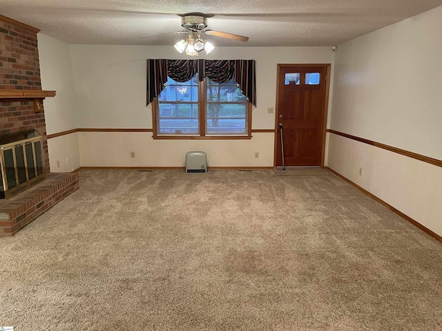504 N Adair St, Clinton, SC 29325 - unfurnished living room featuring carpet flooring, a ceiling fan, a textured ceiling, and a fireplace