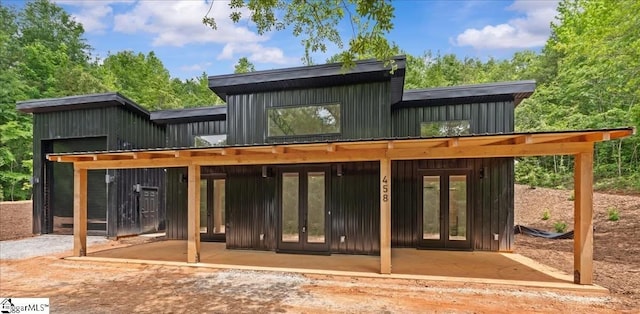 458A Bates Crossing Rd, Travelers Rest, SC 29690 - rear view of property with french doors, board and batten siding, and a patio area