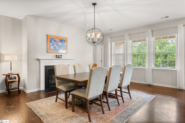 710 Westwood Rd, Lyman, SC 29365 - dining room featuring a chandelier, wood finished floors, and a glass covered fireplace
