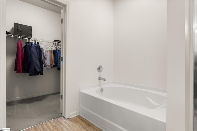 710 Westwood Rd, Lyman, SC 29365 - full bath featuring a bath, a spacious closet, and wood finished floors