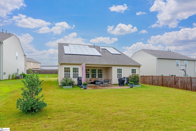 710 Westwood Rd, Lyman, SC 29365 - rear view of property featuring solar panels, a patio, a fenced backyard, and roof with shingles
