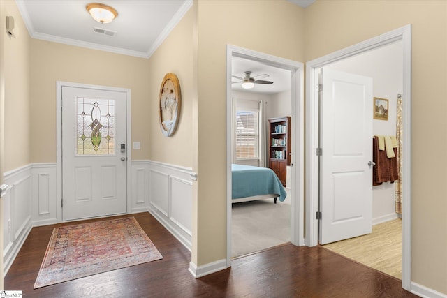 710 Westwood Rd, Lyman, SC 29365 - entrance foyer featuring wood finished floors, crown molding, a ceiling fan, and wainscoting
