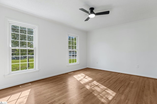 612 Walnut Way, Anderson, SC 29626 - spare room with wood finished floors, a ceiling fan, and ornamental molding