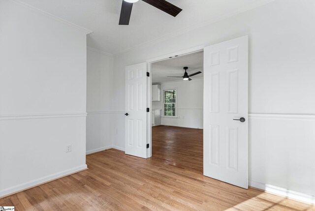 612 Walnut Way, Anderson, SC 29626 - empty room featuring ceiling fan, light wood-style flooring, and crown molding