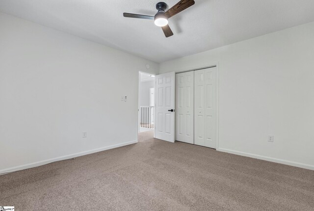 612 Walnut Way, Anderson, SC 29626 - unfurnished bedroom featuring carpet, a closet, and ceiling fan