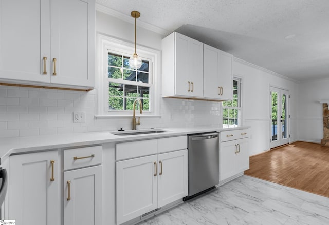 612 Walnut Way, Anderson, SC 29626 - kitchen featuring stainless steel dishwasher, ornamental molding, white cabinets, light countertops, and pendant lighting