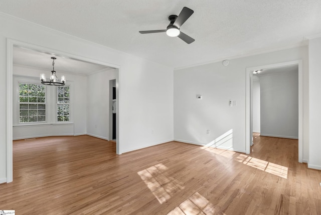 612 Walnut Way, Anderson, SC 29626 - unfurnished room featuring a chandelier, ornamental molding, ceiling fan, and light wood-style flooring