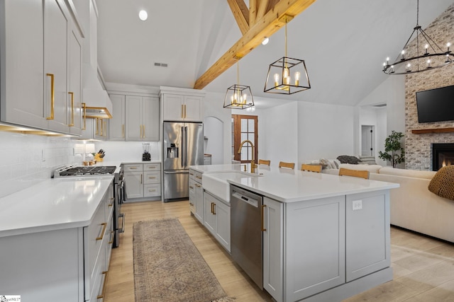 12 Beech Creek Ct, Greer, SC 29651 - kitchen featuring appliances with stainless steel finishes, a chandelier, gray cabinetry, light countertops, and beam ceiling