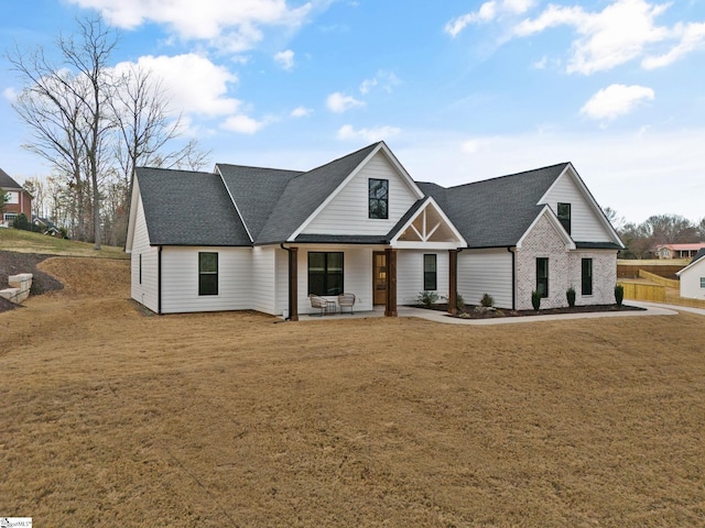 12 Beech Creek Ct, Greer, SC 29651 - modern farmhouse featuring roof with shingles and a front yard