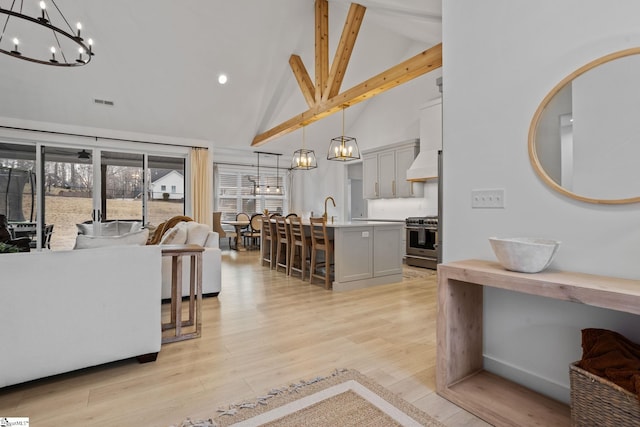 12 Beech Creek Ct, Greer, SC 29651 - living area with a chandelier, high vaulted ceiling, light wood-style flooring, beamed ceiling, and recessed lighting