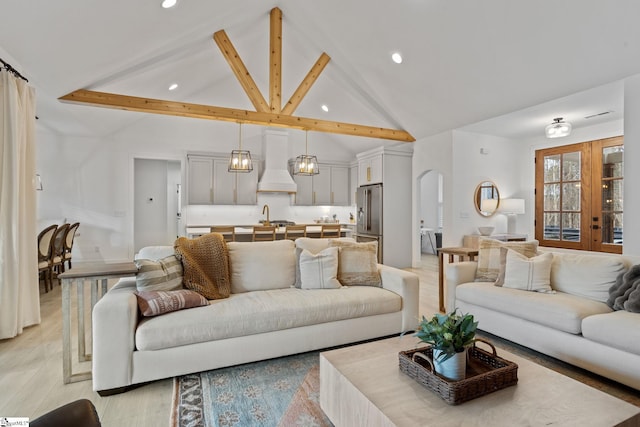 12 Beech Creek Ct, Greer, SC 29651 - living room featuring high vaulted ceiling, recessed lighting, light wood finished floors, beam ceiling, and arched walkways
