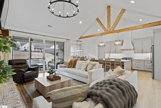 12 Beech Creek Ct, Greer, SC 29651 - living area with high vaulted ceiling, a chandelier, recessed lighting, beam ceiling, and light wood-style flooring