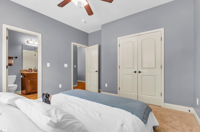 911 Devenger Rd, Greer, SC 29650 - bedroom with a closet, a ceiling fan, ensuite bath, and light colored carpet