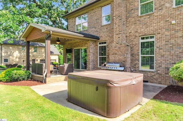 911 Devenger Rd, Greer, SC 29650 - view of patio / terrace with a hot tub, grilling area, a ceiling fan, and an outdoor hangout area