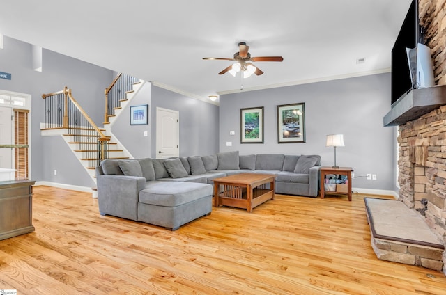 911 Devenger Rd, Greer, SC 29650 - living area with wood finished floors, a ceiling fan, stairway, crown molding, and a fireplace