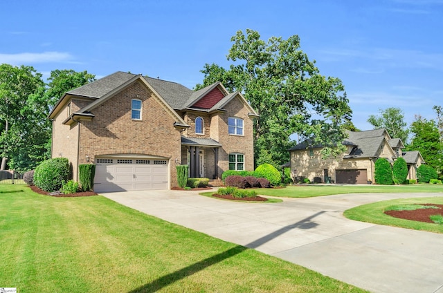 911 Devenger Rd, Greer, SC 29650 - view of front of property featuring driveway, a garage, brick siding, a front yard, and roof with shingles