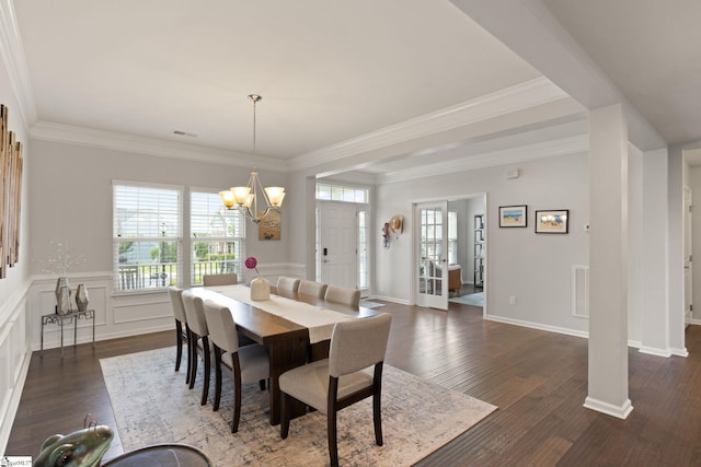 430 Cloverland Ln, Duncan, SC 29334 - dining space with plenty of natural light, a chandelier, dark wood finished floors, ornamental molding, and wainscoting