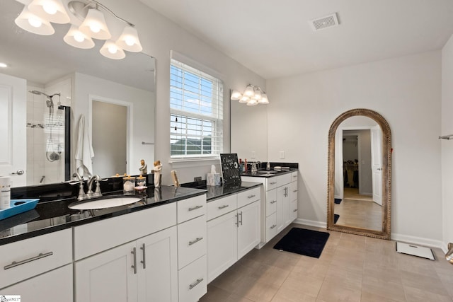 430 Cloverland Ln, Duncan, SC 29334 - full bathroom featuring double vanity, a shower stall, and a chandelier