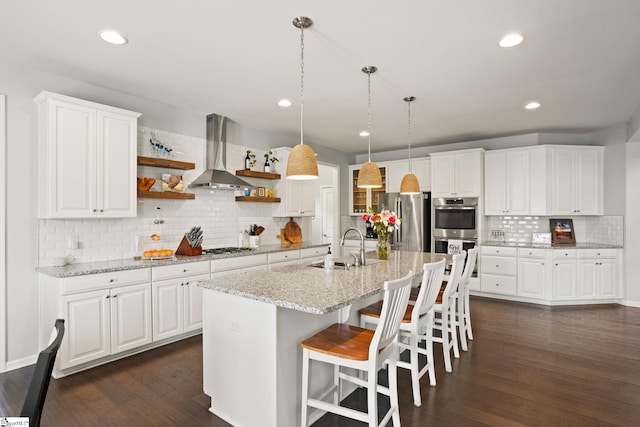 430 Cloverland Ln, Duncan, SC 29334 - kitchen featuring wall chimney exhaust hood, stainless steel appliances, open shelves, decorative backsplash, and dark wood-type flooring