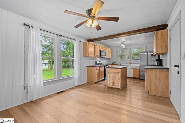 313 S Georgia Ave, Chesnee, SC 29323 - kitchen featuring appliances with stainless steel finishes, light wood-type flooring, a center island, beamed ceiling, and ceiling fan