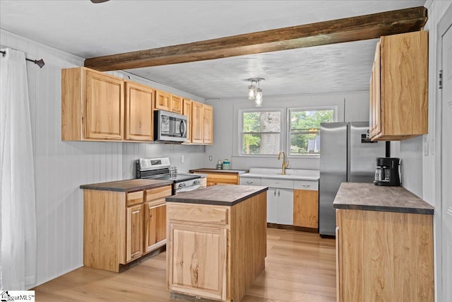 313 S Georgia Ave, Chesnee, SC 29323 - kitchen featuring stainless steel appliances, light wood finished floors, dark countertops, beam ceiling, and a center island