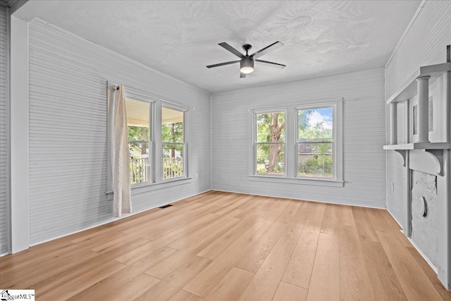 313 S Georgia Ave, Chesnee, SC 29323 - unfurnished living room with light wood-style floors, ceiling fan, and a textured ceiling