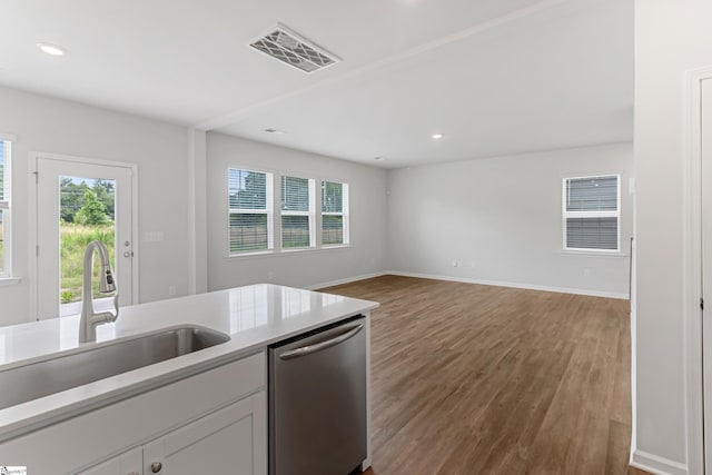 125 Magnolia St, Reidville, SC 29388 - kitchen featuring stainless steel dishwasher, plenty of natural light, wood finished floors, light countertops, and recessed lighting