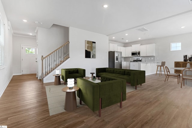 125 Magnolia St, Reidville, SC 29388 - living room featuring stairway, light wood-style floors, and recessed lighting