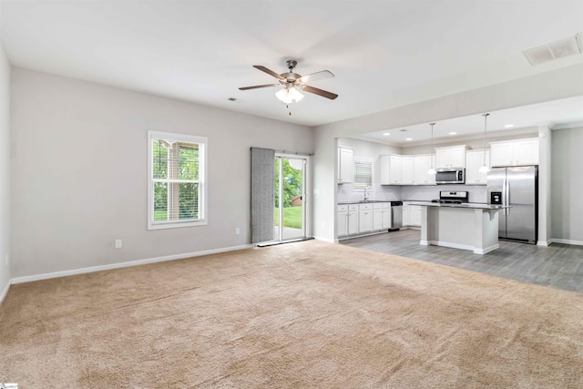 177 Viewmont Dr, Duncan, SC 29334 - unfurnished living room with light carpet, ceiling fan, and recessed lighting