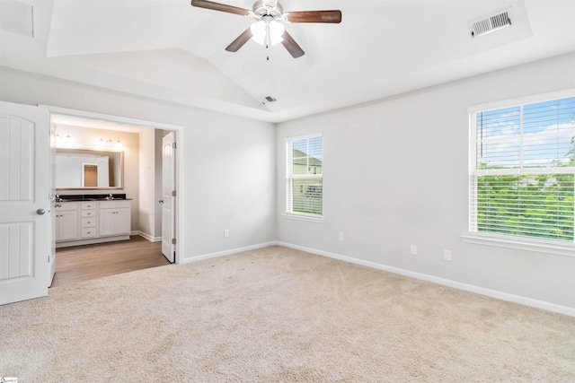 177 Viewmont Dr, Duncan, SC 29334 - unfurnished bedroom featuring light carpet, lofted ceiling, ensuite bath, and a ceiling fan