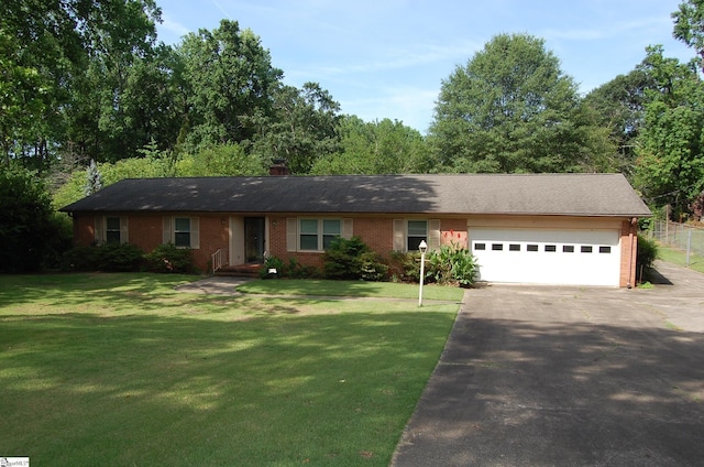 16 Heathwood Cir, Taylors, SC 29687 - ranch-style house with asphalt driveway, an attached garage, brick siding, a front yard, and a chimney