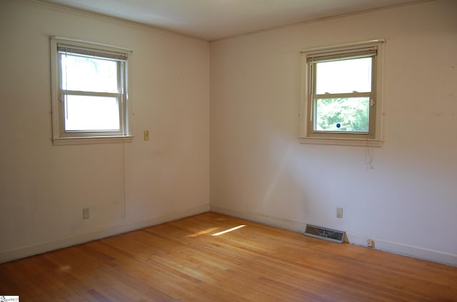 16 Heathwood Cir, Taylors, SC 29687 - spare room with plenty of natural light, light wood-type flooring, and ornamental molding