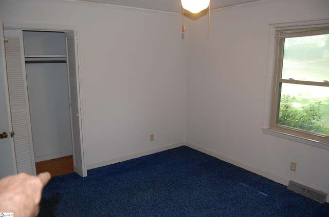 16 Heathwood Cir, Taylors, SC 29687 - unfurnished bedroom with carpet, multiple windows, a closet, and crown molding