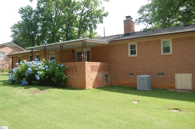 16 Heathwood Cir, Taylors, SC 29687 - back of house featuring brick siding, a yard, and a chimney