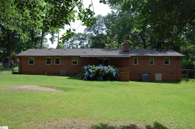 16 Heathwood Cir, Taylors, SC 29687 - back of house featuring crawl space, brick siding, and a chimney