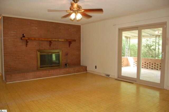 16 Heathwood Cir, Taylors, SC 29687 - unfurnished living room featuring crown molding, ceiling fan, and a brick fireplace