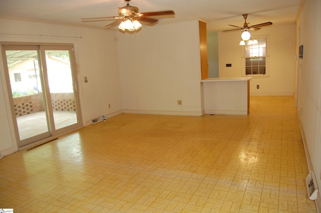16 Heathwood Cir, Taylors, SC 29687 - unfurnished living room featuring ceiling fan, brick patterned floors, and crown molding