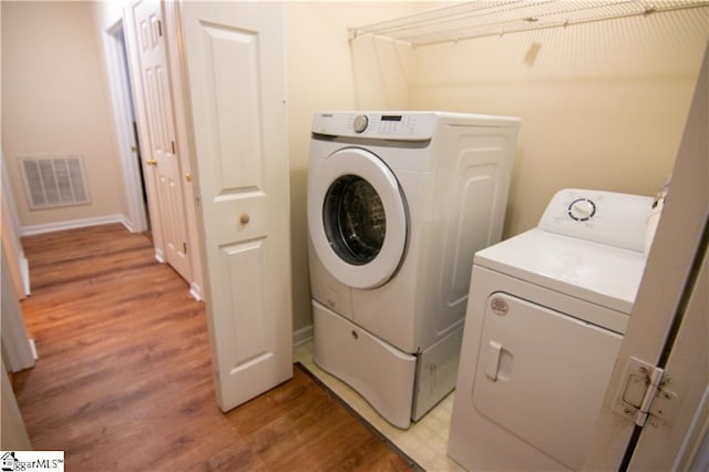 124 Grand Oak Dr, Pendleton, SC 29670 - laundry room featuring washing machine and dryer and light wood-style floors