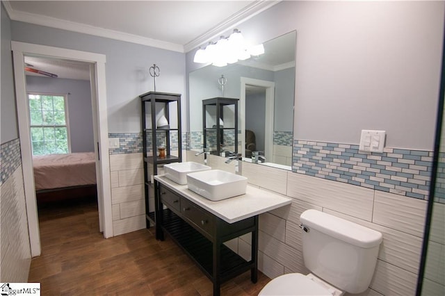 124 Grand Oak Dr, Pendleton, SC 29670 - bathroom featuring tile walls, double vanity, wood finished floors, ensuite bathroom, and ornamental molding