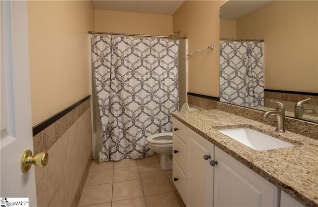 124 Grand Oak Dr, Pendleton, SC 29670 - bathroom with vanity, a wainscoted wall, and tile patterned floors