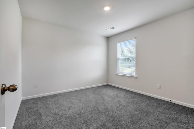 1808 Bridle Ln, Roebuck, SC 29376 - unfurnished room featuring dark colored carpet and baseboards