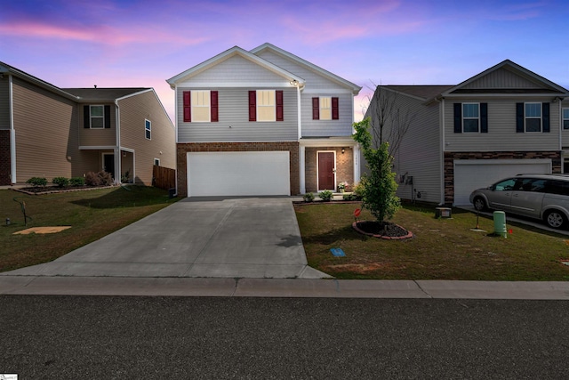 1808 Bridle Ln, Roebuck, SC 29376 - traditional-style home with an attached garage, driveway, a front lawn, and brick siding
