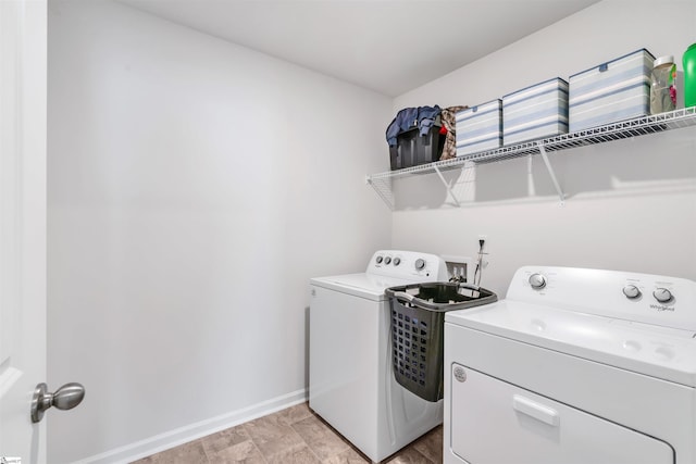 1808 Bridle Ln, Roebuck, SC 29376 - laundry area featuring washing machine and clothes dryer and baseboards