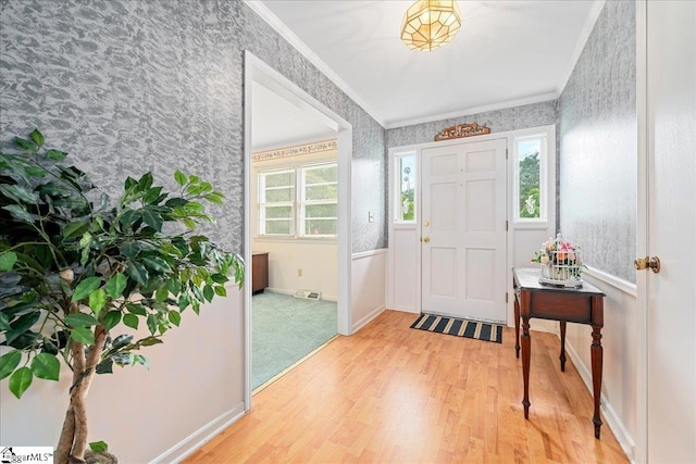 200 Camille St, Easley, SC 29642 - foyer with wallpapered walls, light wood-type flooring, crown molding, and healthy amount of natural light