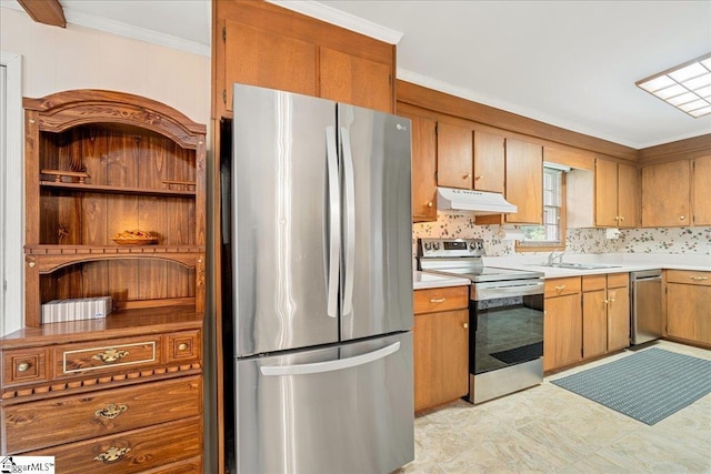 200 Camille St, Easley, SC 29642 - kitchen featuring appliances with stainless steel finishes, under cabinet range hood, light countertops, crown molding, and brown cabinetry
