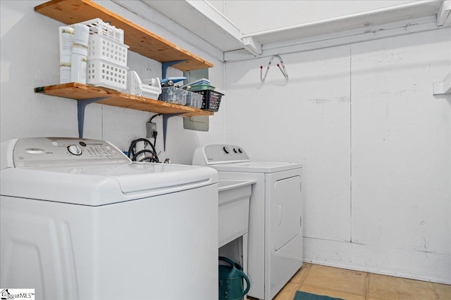 200 Camille St, Easley, SC 29642 - laundry room with washer and dryer and light tile patterned flooring